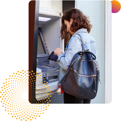 Picture of a woman using her Wellby ATM card at a walk up ATM
